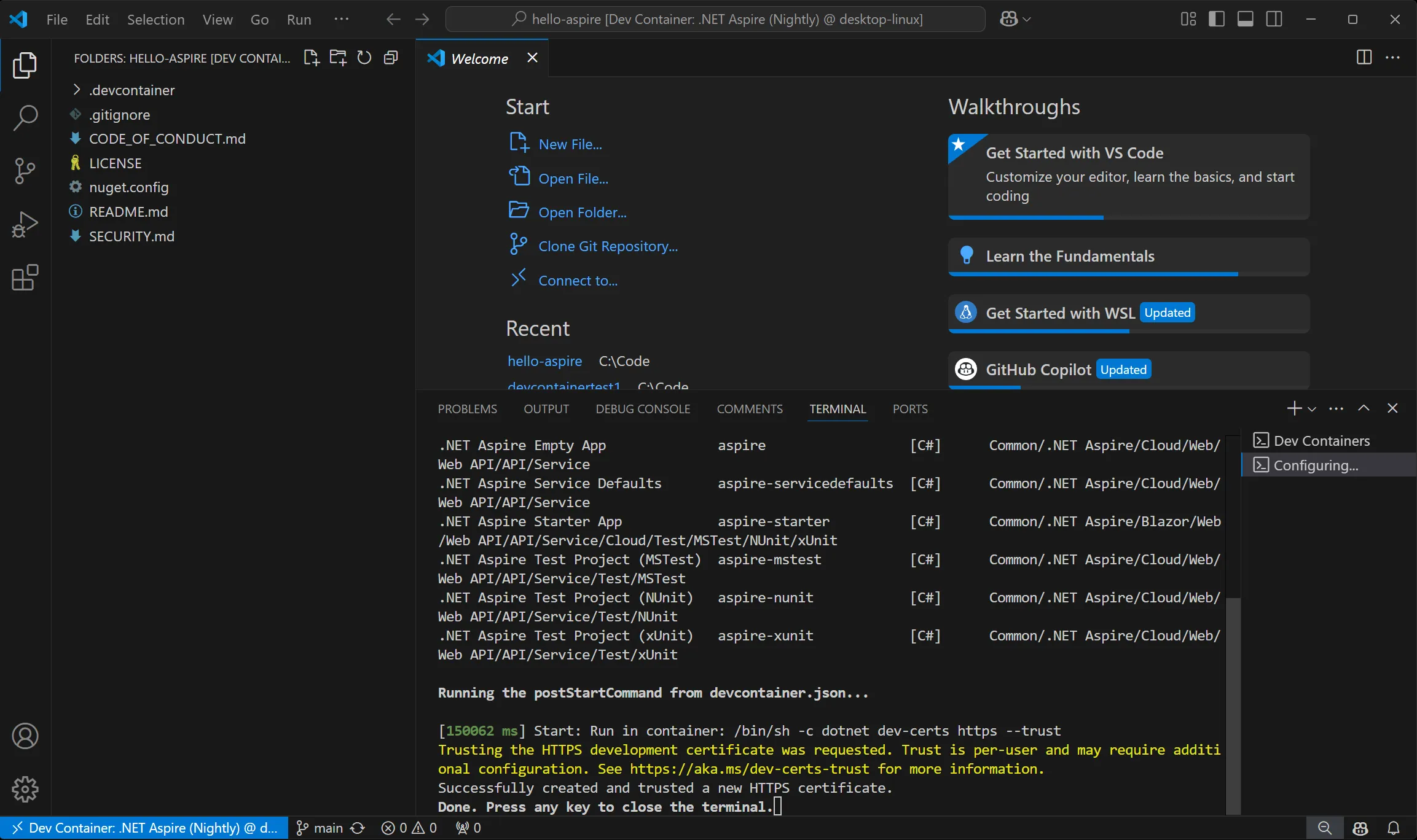 Screenshot showing the dev container build completed notification in VS Code.